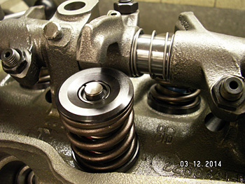 Dual valve springs single groove locks